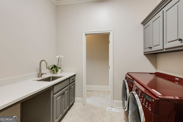 314 Caruso Ct, Sandy Springs, GA 30350 - washroom with washer and dryer, cabinet space, light tile patterned floors, and ornamental molding