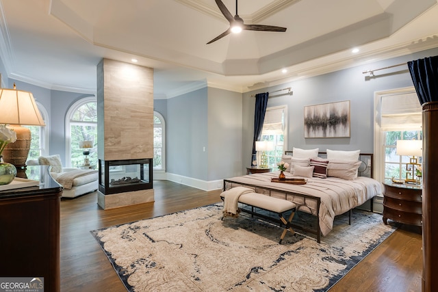 314 Caruso Ct, Sandy Springs, GA 30350 - bedroom with a raised ceiling, ornamental molding, a fireplace, dark wood finished floors, and recessed lighting