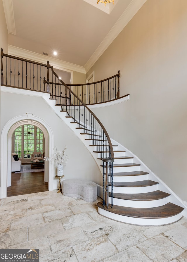 314 Caruso Ct, Sandy Springs, GA 30350 - stairway with a towering ceiling, crown molding, stone tile floors, and recessed lighting