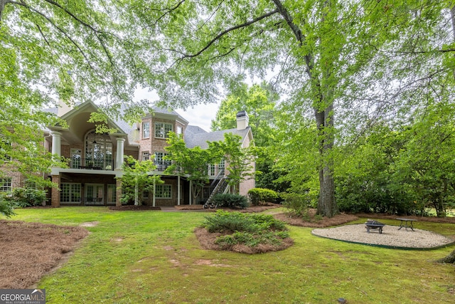 314 Caruso Ct, Sandy Springs, GA 30350 - view of grassy yard featuring a fire pit