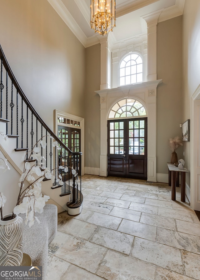 314 Caruso Ct, Sandy Springs, GA 30350 - entryway featuring a high ceiling, stairway, crown molding, stone tile flooring, and a chandelier