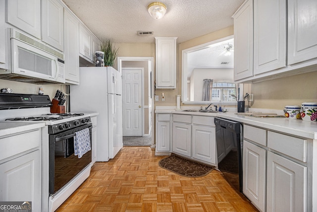 7008 Glen Valley Way, Fairburn, GA 30213 - kitchen with white appliances, white cabinetry, a sink, light countertops, and a textured ceiling