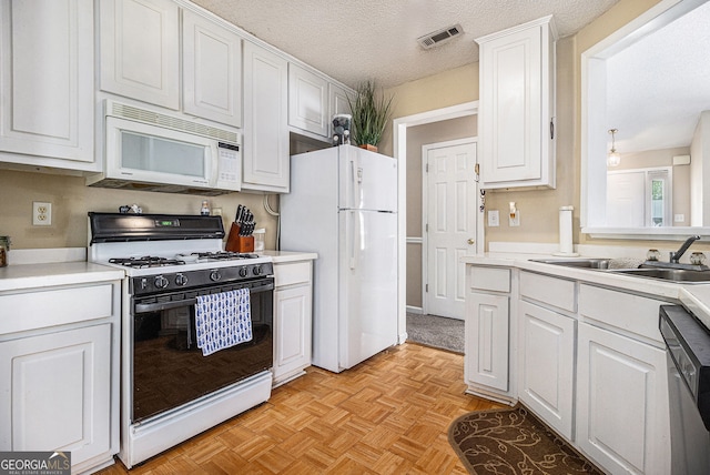 7008 Glen Valley Way, Fairburn, GA 30213 - kitchen featuring white appliances, a sink, white cabinets, light countertops, and a textured ceiling