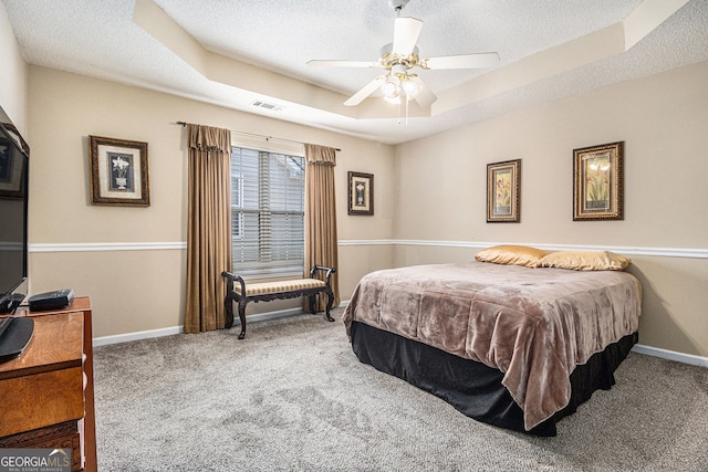 7008 Glen Valley Way, Fairburn, GA 30213 - bedroom featuring carpet, a tray ceiling, a textured ceiling, baseboards, and ceiling fan