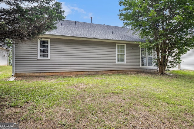 7008 Glen Valley Way, Fairburn, GA 30213 - rear view of property with a lawn and a shingled roof
