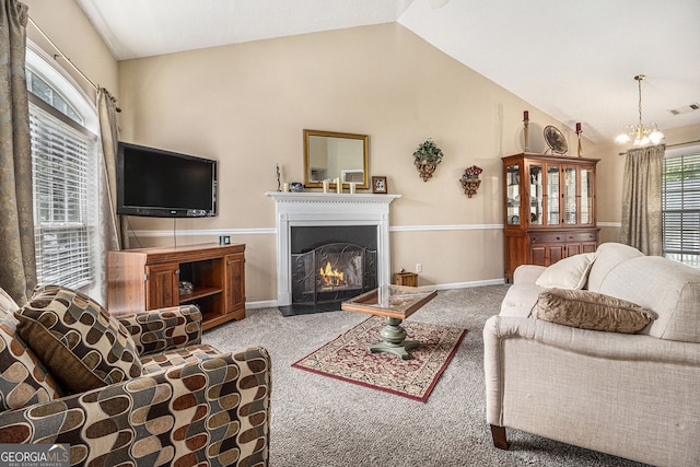 7008 Glen Valley Way, Fairburn, GA 30213 - living room with carpet, lofted ceiling, a warm lit fireplace, a chandelier, and baseboards
