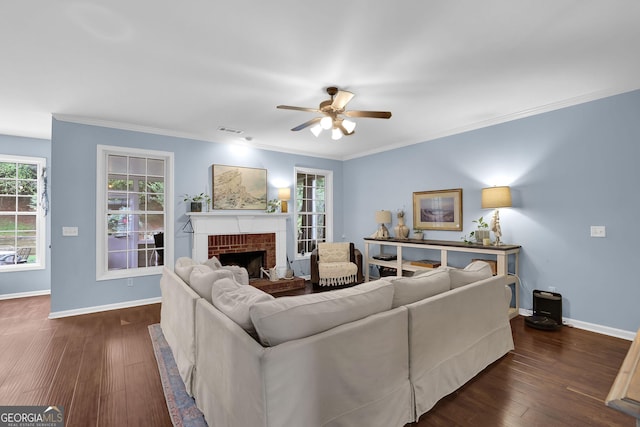 4218 Sandy Branch Dr, Buford, GA 30519 - living room featuring a fireplace, a ceiling fan, dark wood-type flooring, baseboards, and ornamental molding
