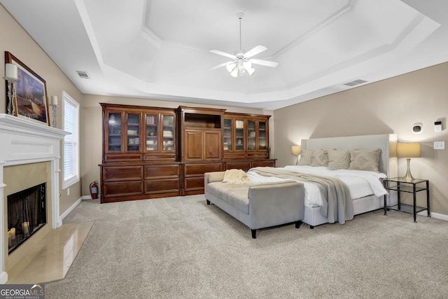 4218 Sandy Branch Dr, Buford, GA 30519 - carpeted bedroom with a raised ceiling, a premium fireplace, baseboards, and ceiling fan