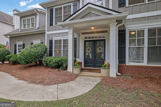 4218 Sandy Branch Dr, Buford, GA 30519 - entrance to property featuring board and batten siding and french doors