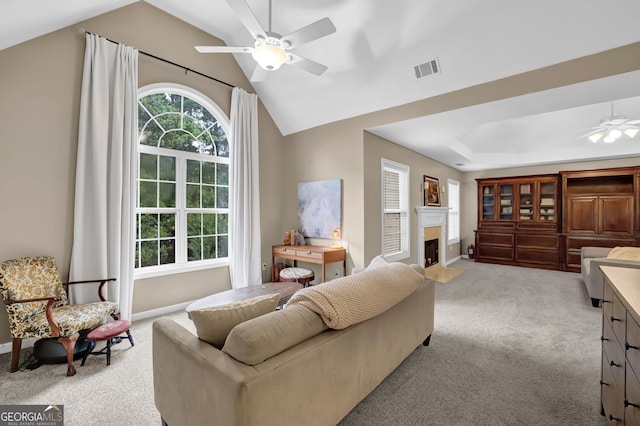 4218 Sandy Branch Dr, Buford, GA 30519 - living room with ceiling fan, light carpet, a fireplace with flush hearth, baseboards, and lofted ceiling