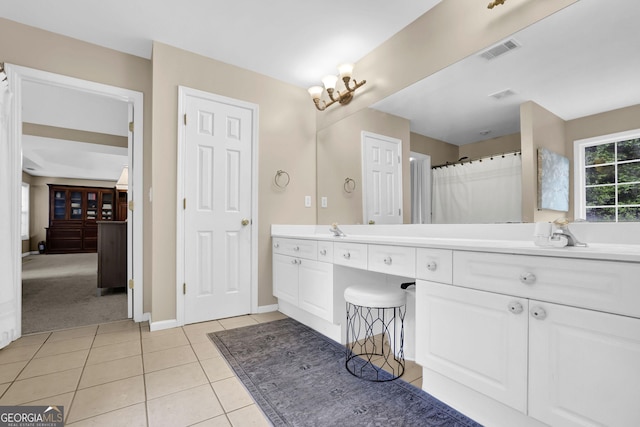 4218 Sandy Branch Dr, Buford, GA 30519 - bathroom with double vanity, tile patterned flooring, and baseboards