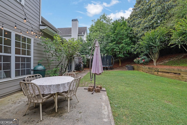 4218 Sandy Branch Dr, Buford, GA 30519 - view of patio / terrace featuring a trampoline and outdoor dining space