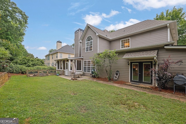 4218 Sandy Branch Dr, Buford, GA 30519 - rear view of property featuring a patio, french doors, a lawn, and a sunroom