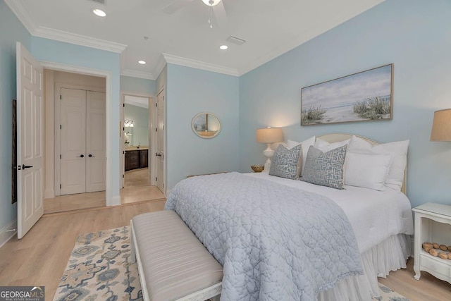 3100 Prince Ln, Saint Simons, GA 31522 - bedroom featuring wood finished floors, crown molding, ensuite bath, recessed lighting, and baseboards