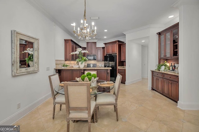 3100 Prince Ln, Saint Simons, GA 31522 - dining space featuring a chandelier, crown molding, baseboards, recessed lighting, and light tile patterned floors