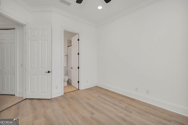 3100 Prince Ln, Saint Simons, GA 31522 - unfurnished bedroom featuring light wood finished floors, ornamental molding, baseboards, recessed lighting, and ensuite bathroom