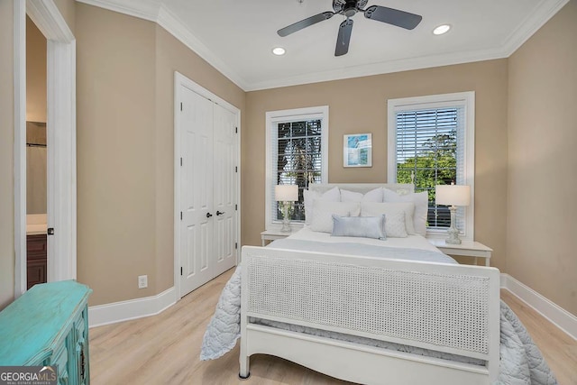 3100 Prince Ln, Saint Simons, GA 31522 - bedroom with light wood-type flooring, crown molding, baseboards, recessed lighting, and a closet