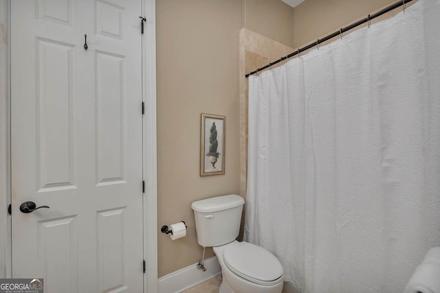 3100 Prince Ln, Saint Simons, GA 31522 - bathroom with toilet, baseboards, and curtained shower