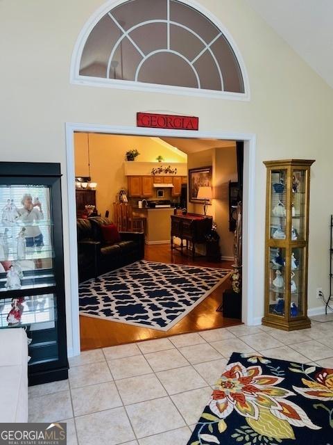 1535 Duluth Hwy Unit 1101, Lawrenceville, GA 30043 - living area featuring high vaulted ceiling and light tile patterned floors