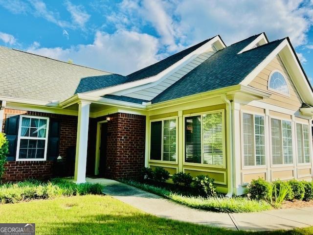 1535 Duluth Hwy Unit 1101, Lawrenceville, GA 30043 - view of front of house featuring brick siding and a shingled roof
