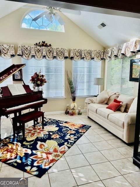 1535 Duluth Hwy Unit 1101, Lawrenceville, GA 30043 - living room with lofted ceiling, light tile patterned floors, ceiling fan, and baseboards