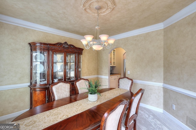 1850 Noblin Ridge Way, Duluth, GA 30097 - dining space featuring arched walkways, a chandelier, and crown molding