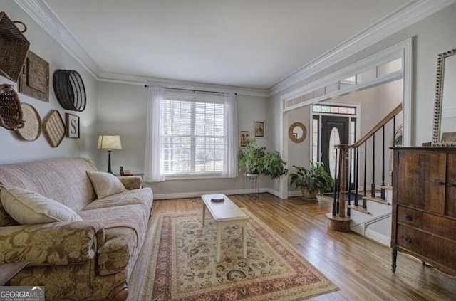 5327 Saville Dr NW, Acworth, GA 30101 - living area with crown molding, wood finished floors, and stairway