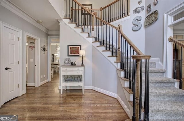 5327 Saville Dr NW, Acworth, GA 30101 - stairway with wood finished floors and ornamental molding