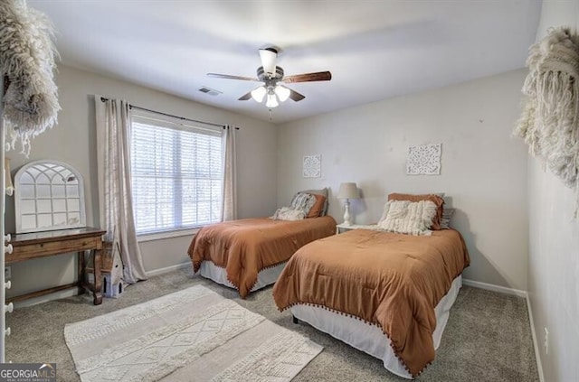 5327 Saville Dr NW, Acworth, GA 30101 - carpeted bedroom with baseboards and a ceiling fan