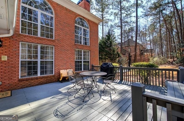 5327 Saville Dr NW, Acworth, GA 30101 - wooden terrace with outdoor dining area