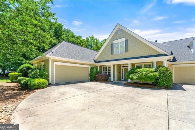 2001 Macland Square Dr Unit 11, Marietta, GA 30064 - view of front facade with driveway, an attached garage, roof with shingles, and covered porch