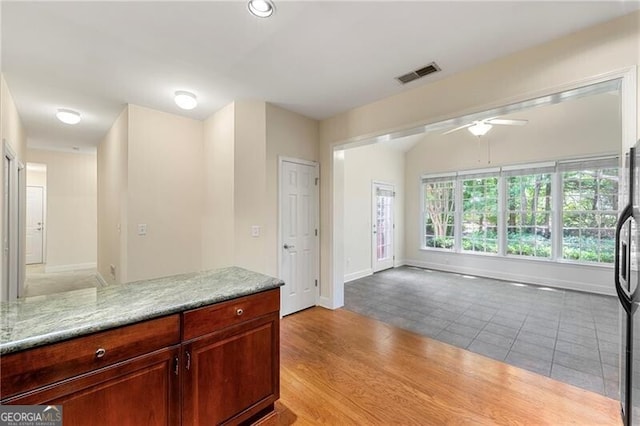 2001 Macland Square Dr Unit 11, Marietta, GA 30064 - kitchen with ceiling fan, baseboards, light stone countertops, and light tile patterned floors