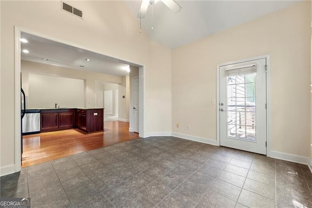 2001 Macland Square Dr Unit 11, Marietta, GA 30064 - unfurnished living room featuring ceiling fan, baseboards, tile patterned floors, and a sink