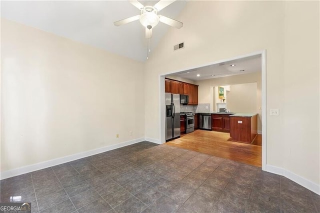 2001 Macland Square Dr Unit 11, Marietta, GA 30064 - unfurnished living room featuring baseboards, a ceiling fan, high vaulted ceiling, and dark tile patterned flooring