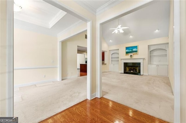 2001 Macland Square Dr Unit 11, Marietta, GA 30064 - unfurnished living room featuring carpet, ornamental molding, a fireplace with flush hearth, baseboards, and built in shelves