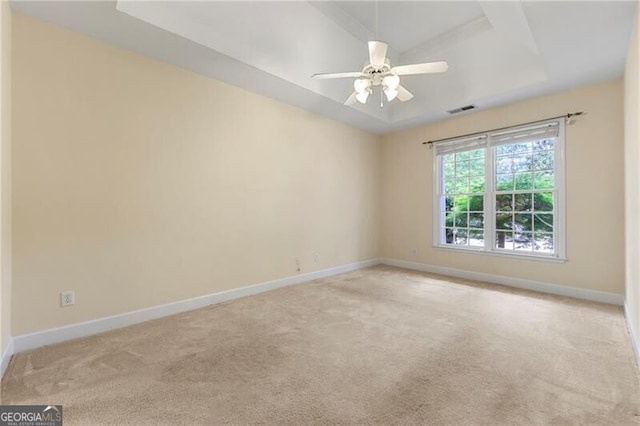 2001 Macland Square Dr Unit 11, Marietta, GA 30064 - empty room featuring light carpet, baseboards, ceiling fan, and a raised ceiling