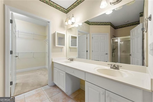 2001 Macland Square Dr Unit 11, Marietta, GA 30064 - bathroom with a shower stall, double vanity, tile patterned flooring, and a spacious closet