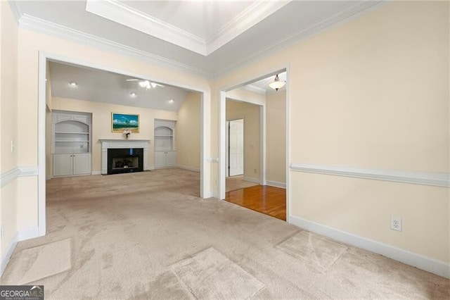2001 Macland Square Dr Unit 11, Marietta, GA 30064 - unfurnished living room with crown molding, carpet floors, a fireplace, baseboards, and built in shelves