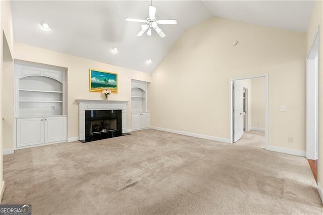2001 Macland Square Dr Unit 11, Marietta, GA 30064 - unfurnished living room featuring ceiling fan, carpet floors, built in features, a fireplace with flush hearth, and high vaulted ceiling