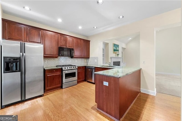 2001 Macland Square Dr Unit 11, Marietta, GA 30064 - kitchen featuring stainless steel appliances, a peninsula, a sink, light wood finished floors, and recessed lighting