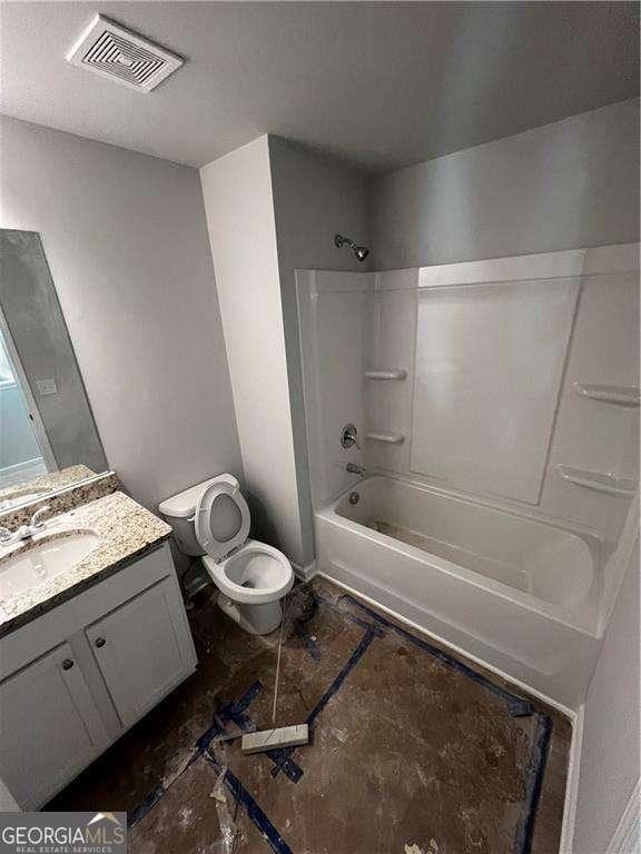 192 Paces Lakes Pt, Dallas, GA 30157 - bathroom featuring toilet, vanity, and tub / shower combination