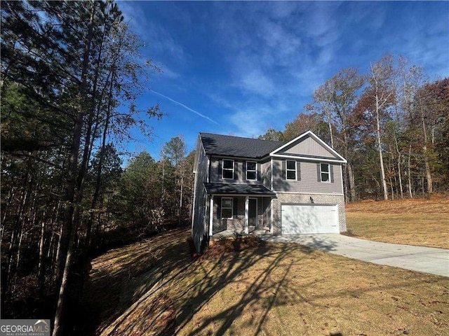 192 Paces Lakes Pt, Dallas, GA 30157 - traditional-style house featuring concrete driveway, an attached garage, a front lawn, and a porch