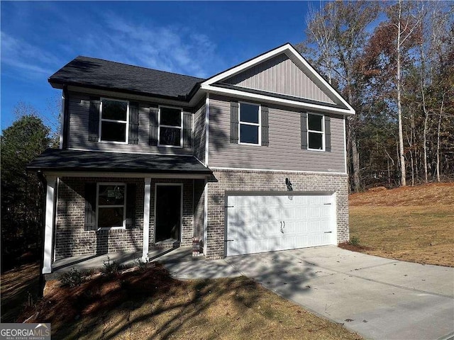 192 Paces Lakes Pt, Dallas, GA 30157 - view of front of home featuring brick siding, an attached garage, covered porch, and concrete driveway