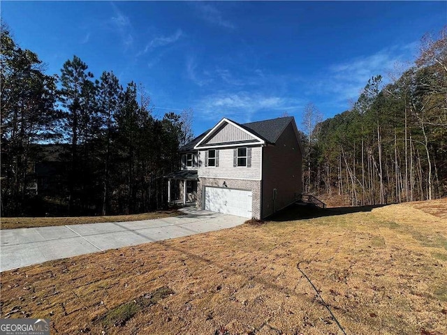192 Paces Lakes Pt, Dallas, GA 30157 - view of side of home featuring a garage, driveway, and a lawn