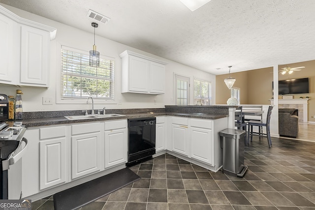 5125 Winding Glen Dr, Lithonia, GA 30038 - kitchen with black dishwasher, a sink, white cabinetry, dark countertops, and range with electric cooktop
