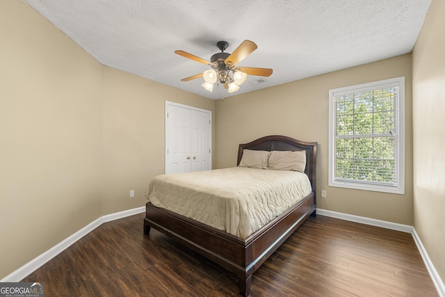 5125 Winding Glen Dr, Lithonia, GA 30038 - bedroom featuring baseboards, wood finished floors, ceiling fan, a closet, and a textured ceiling