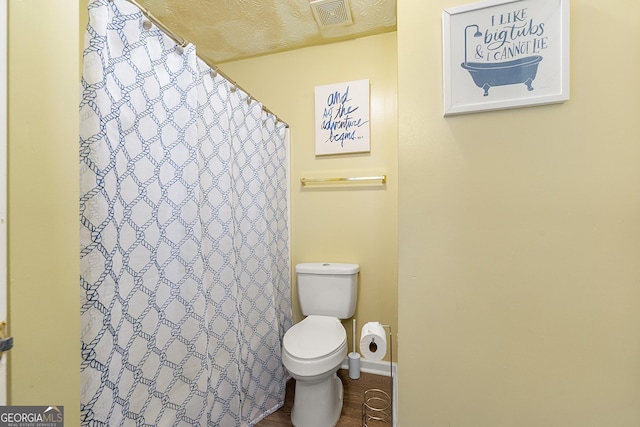 5125 Winding Glen Dr, Lithonia, GA 30038 - bathroom with toilet, a shower with shower curtain, and baseboards