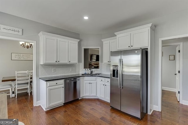 440 S Alexander St, Buford, GA 30518 - kitchen with appliances with stainless steel finishes, a sink, white cabinetry, a chandelier, and recessed lighting