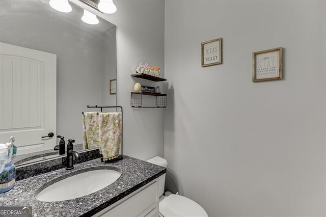 440 S Alexander St, Buford, GA 30518 - half bathroom featuring vanity and toilet