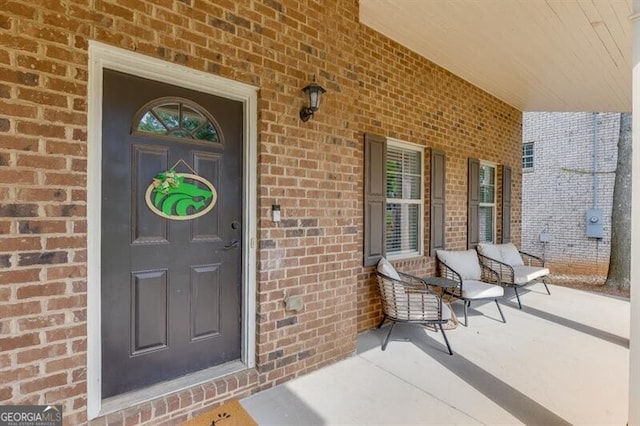 440 S Alexander St, Buford, GA 30518 - doorway to property with covered porch and brick siding